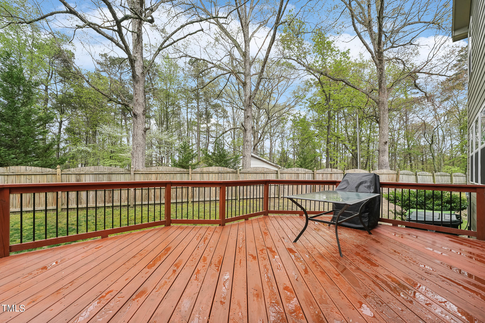5608 Spring Glen Lane Raleigh, NC 27616 - Photo 30 of 30 a view of a two chairs on deck with wooden floor and fence