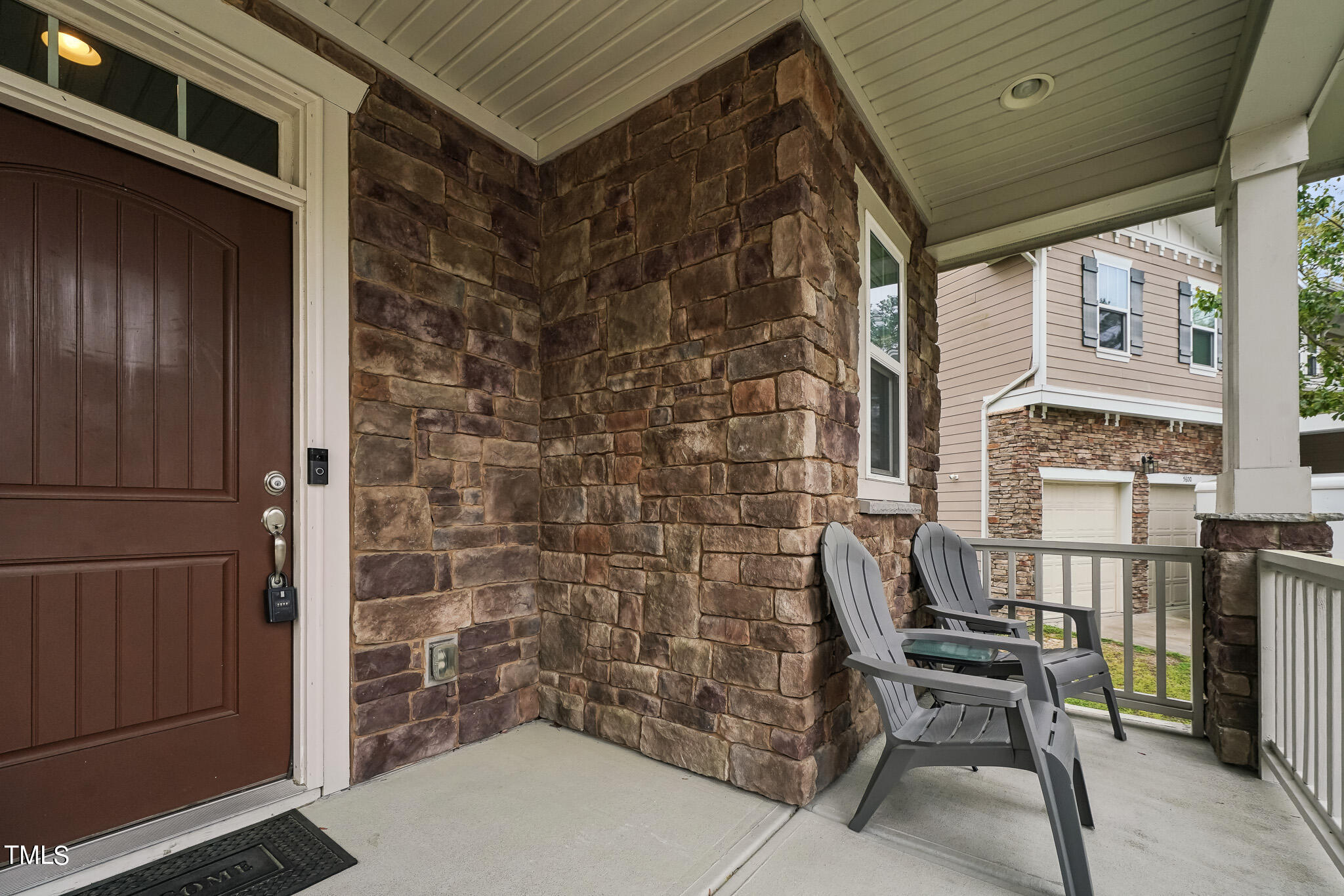 5608 Spring Glen Lane Raleigh, NC 27616 - Photo 3 of 30 a balcony with chairs and bench
