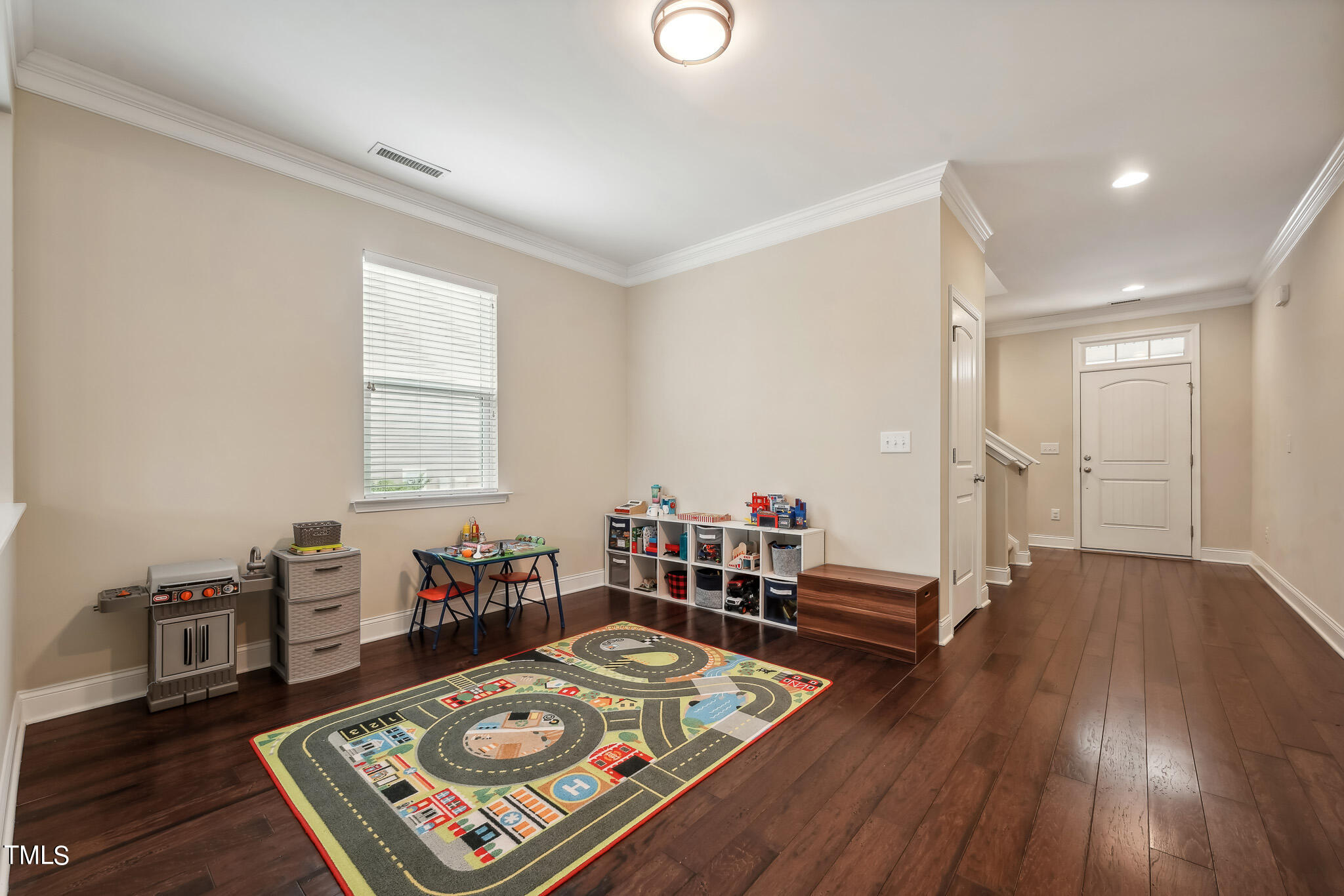 5608 Spring Glen Lane Raleigh, NC 27616 - Photo 6 of 30 a living room with furniture and wooden floor