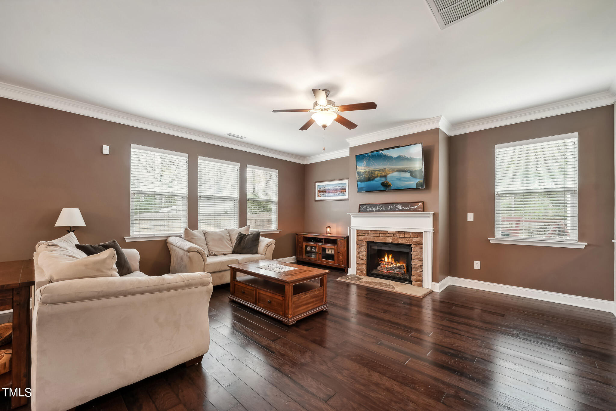 5608 Spring Glen Lane Raleigh, NC 27616 - Photo 7 of 30 a living room with furniture fireplace and window