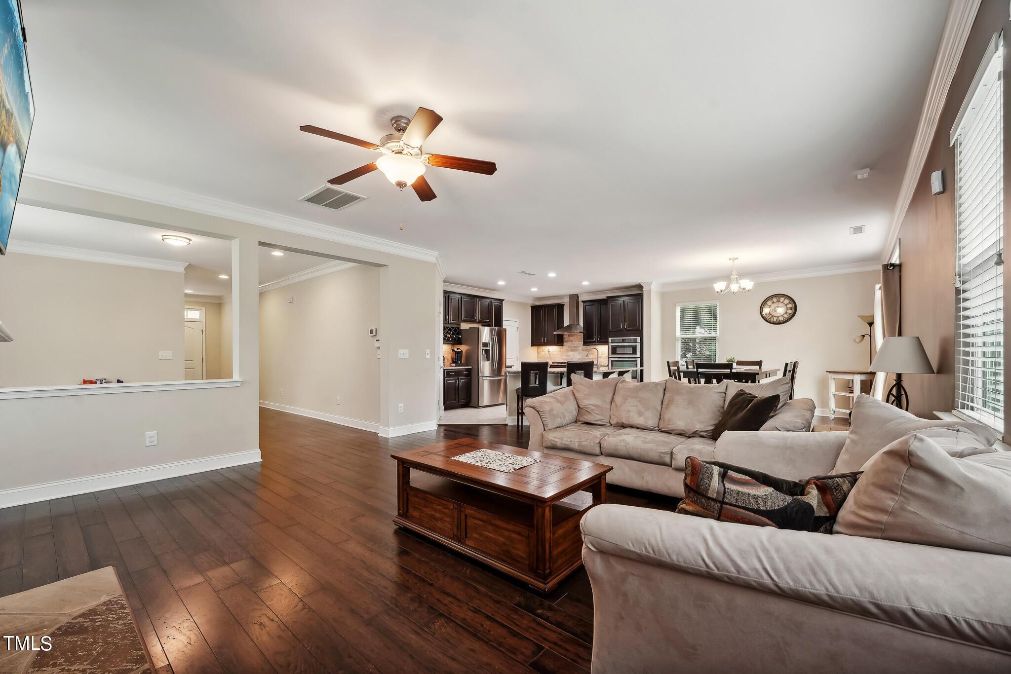 5608 Spring Glen Lane Raleigh, NC 27616 - Photo 9 of 30 a living room with furniture and a ceiling fan