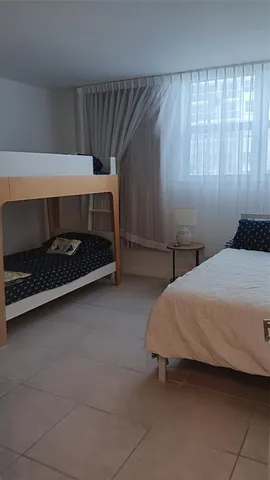 a bathroom with a shower and a bath tub