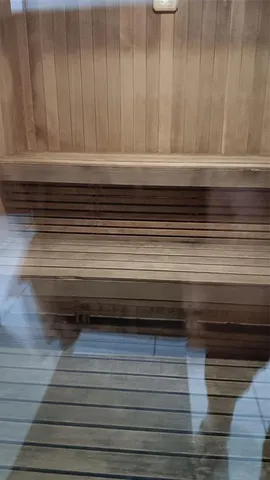 a view of a dry yard with wooden fence