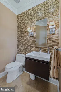 a bathroom with a granite countertop sink mirror and a bathtub