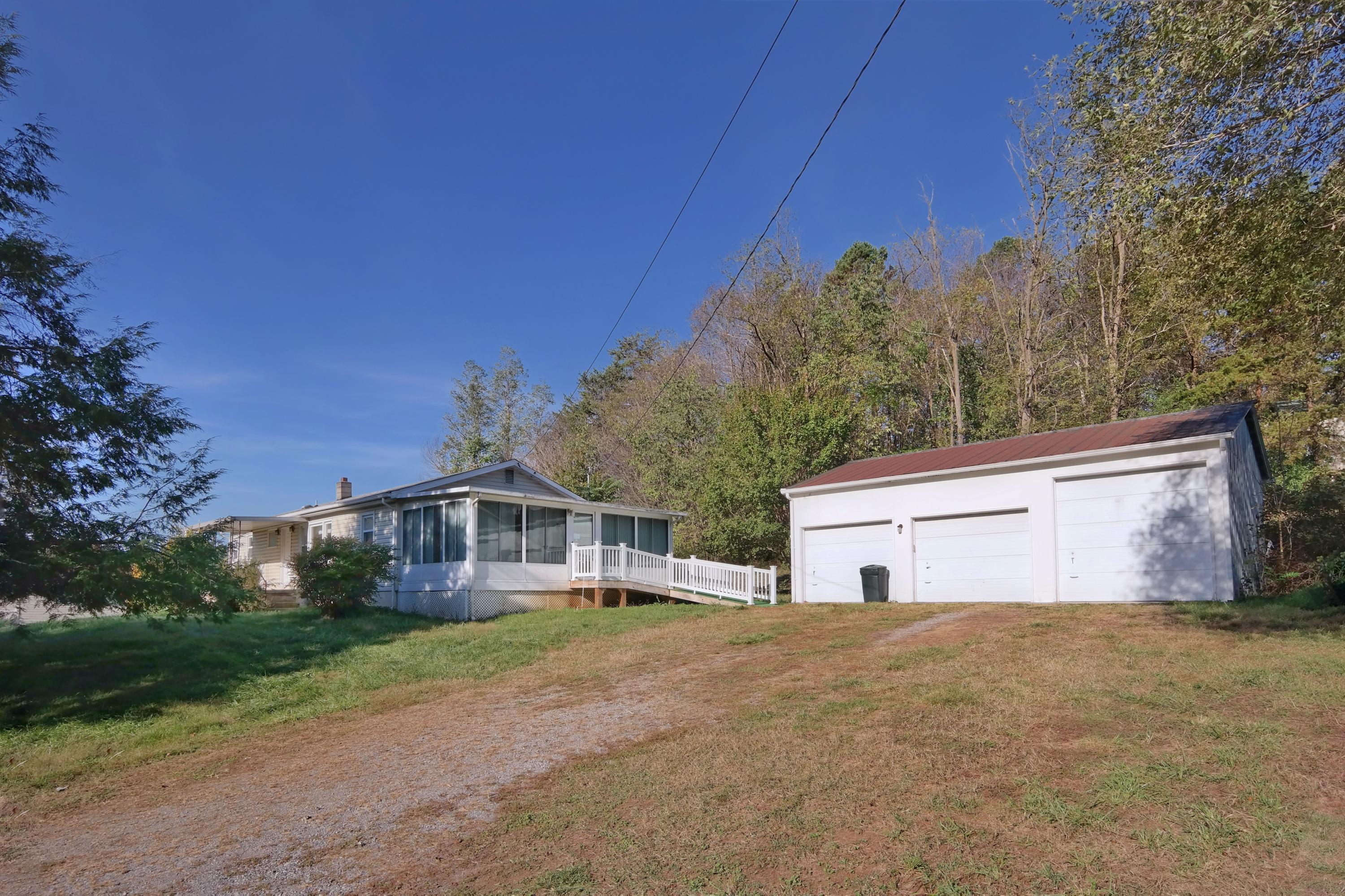 3871 Blue Ridge Boulevard Blue Ridge, VA 24064 - Photo 1 of 7 a view of house with yard and trees in the background