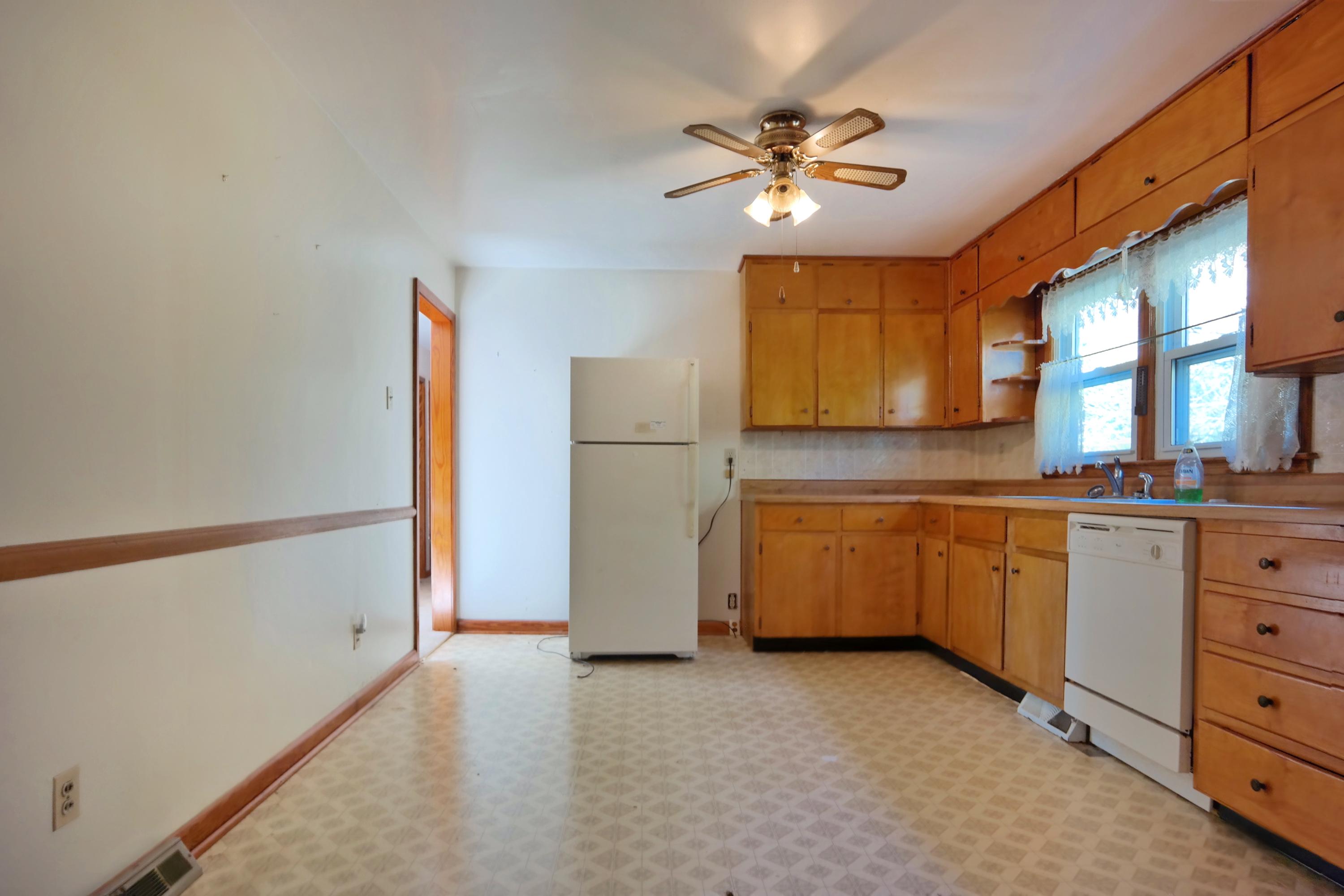3871 Blue Ridge Boulevard Blue Ridge, VA 24064 - Photo 3 of 7 a kitchen with refrigerator and cabinets