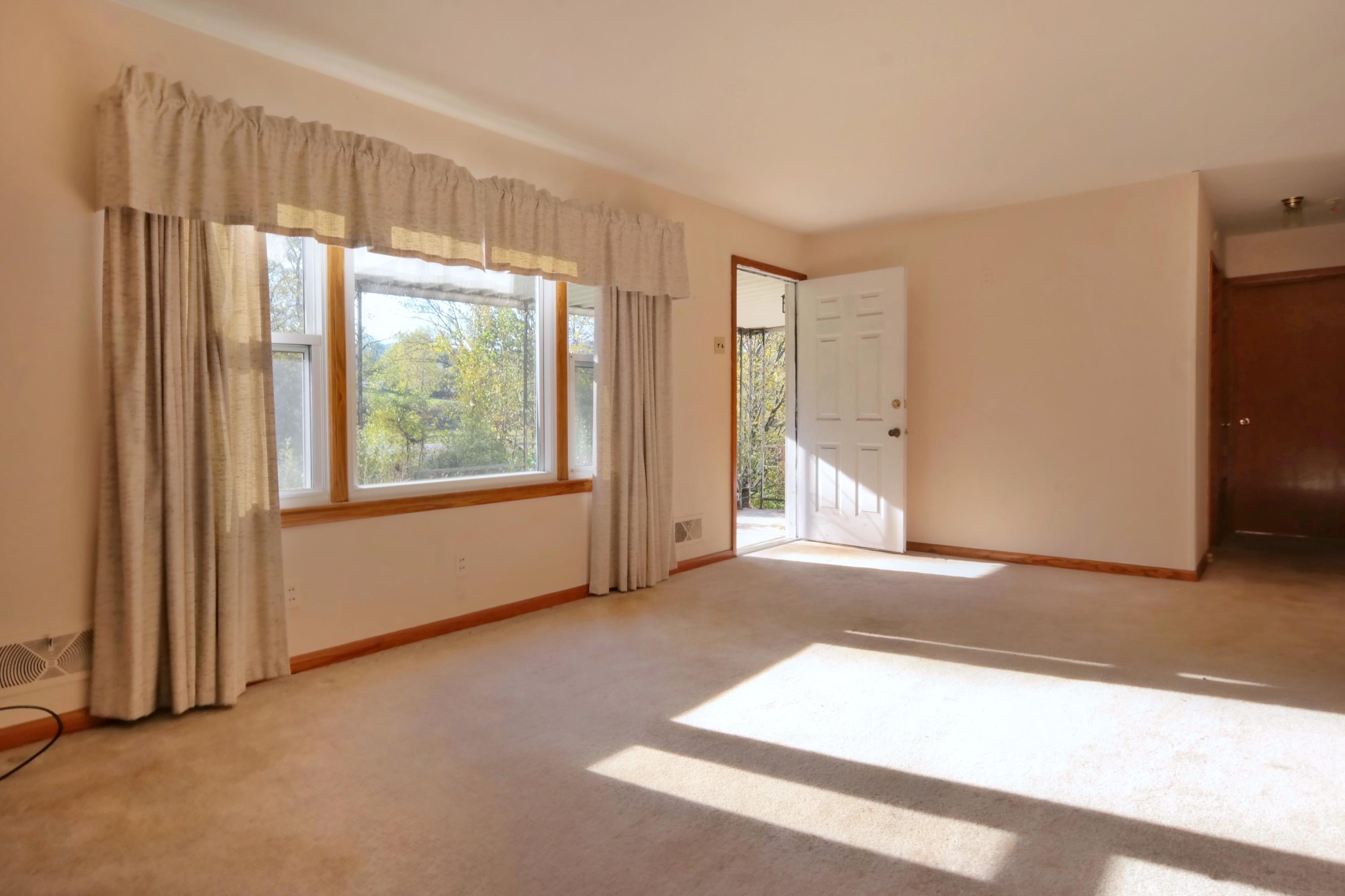3871 Blue Ridge Boulevard Blue Ridge, VA 24064 - Photo 5 of 7 an empty room with windows