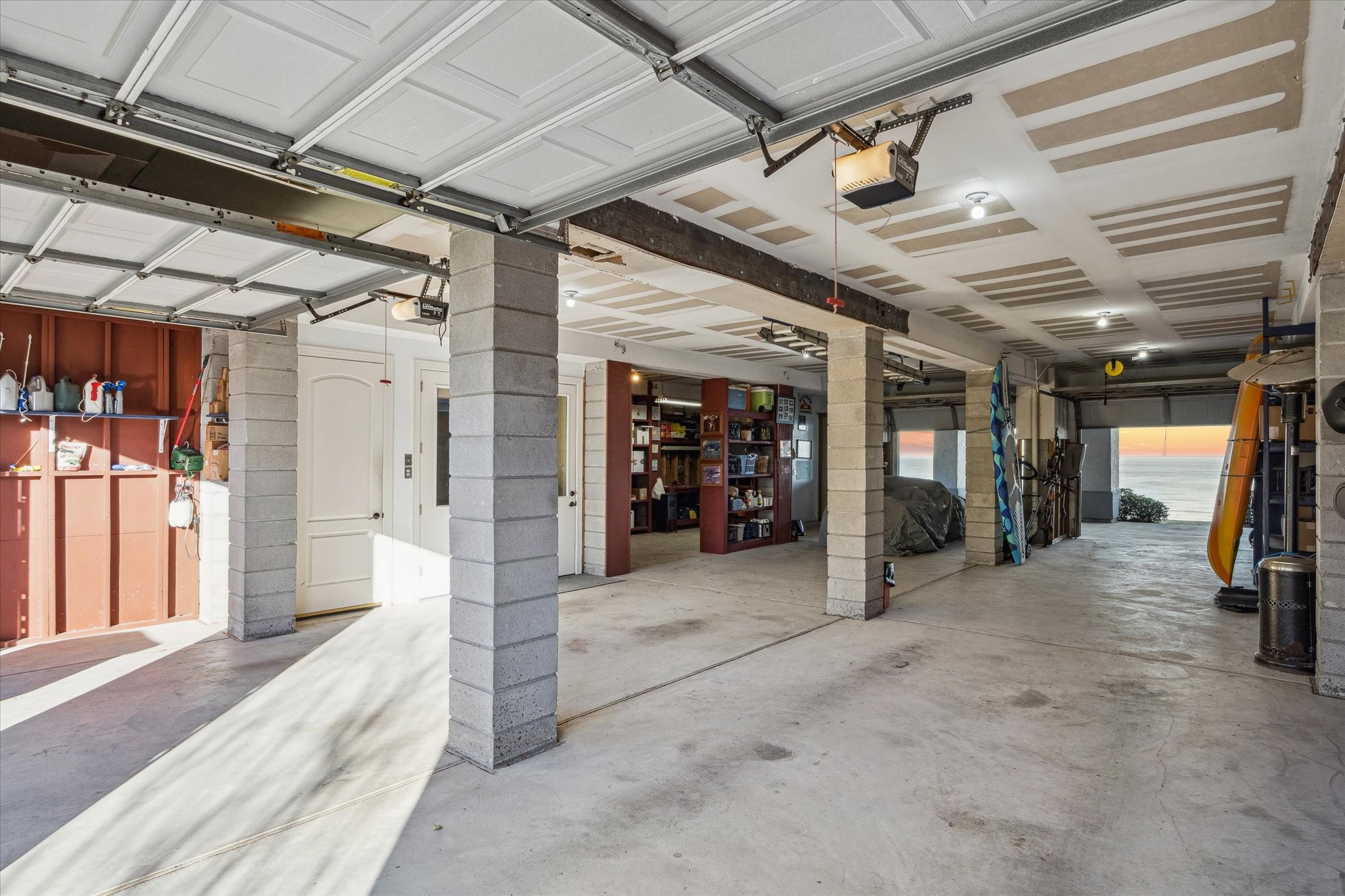 1406 Todville Road Seabrook, TX 77586 - Photo 43 of 50 GARAGE DOORS OPEN TO REVEAL AN INCREDIBLE 1,400+ SQUARE FEET, 6 CAR TANDEM GARAGE.