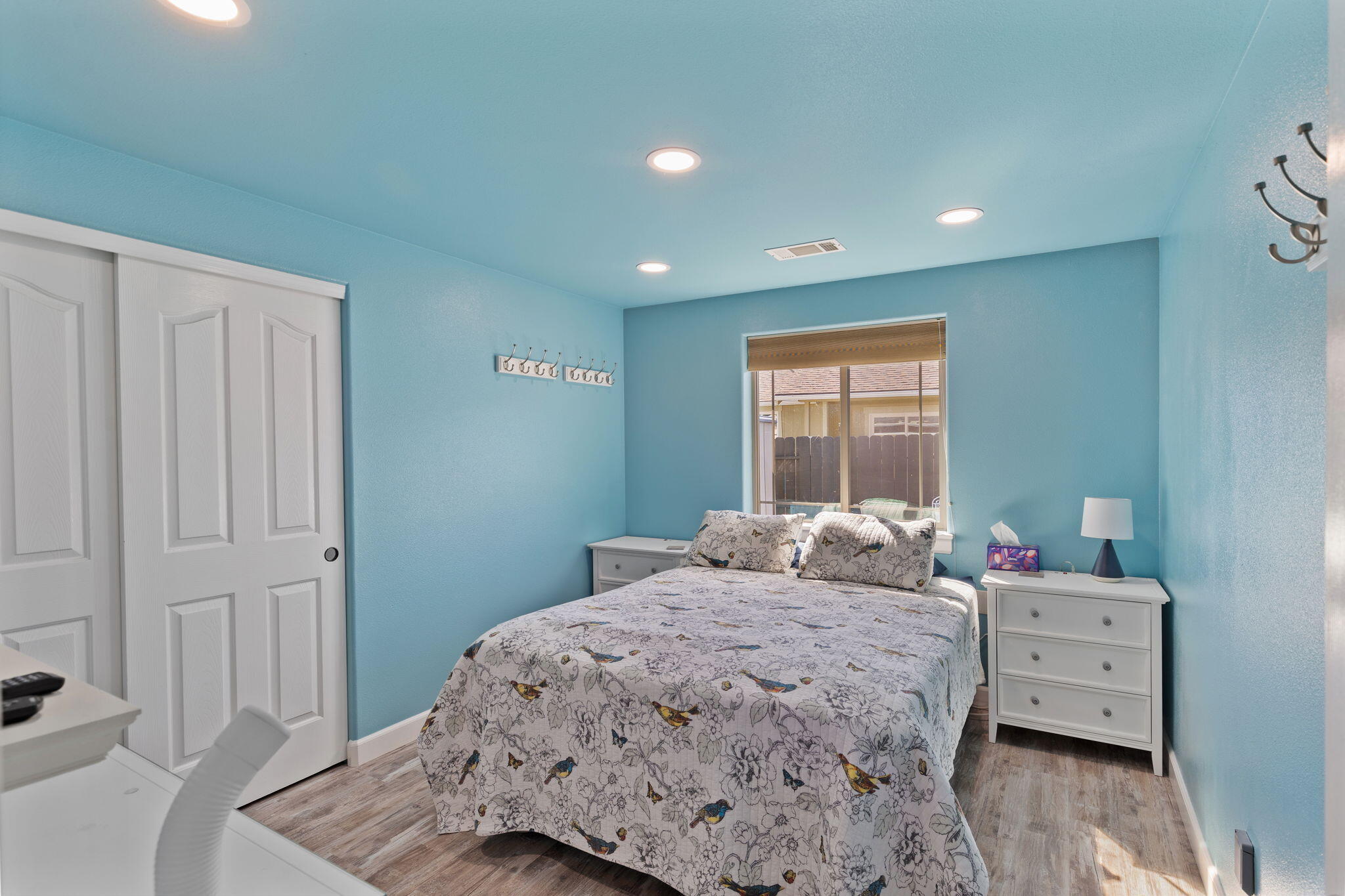 404 Lindilu Lane Cave Junction, OR 97523 - Photo 22 of 60 a bedroom with a bed and a window