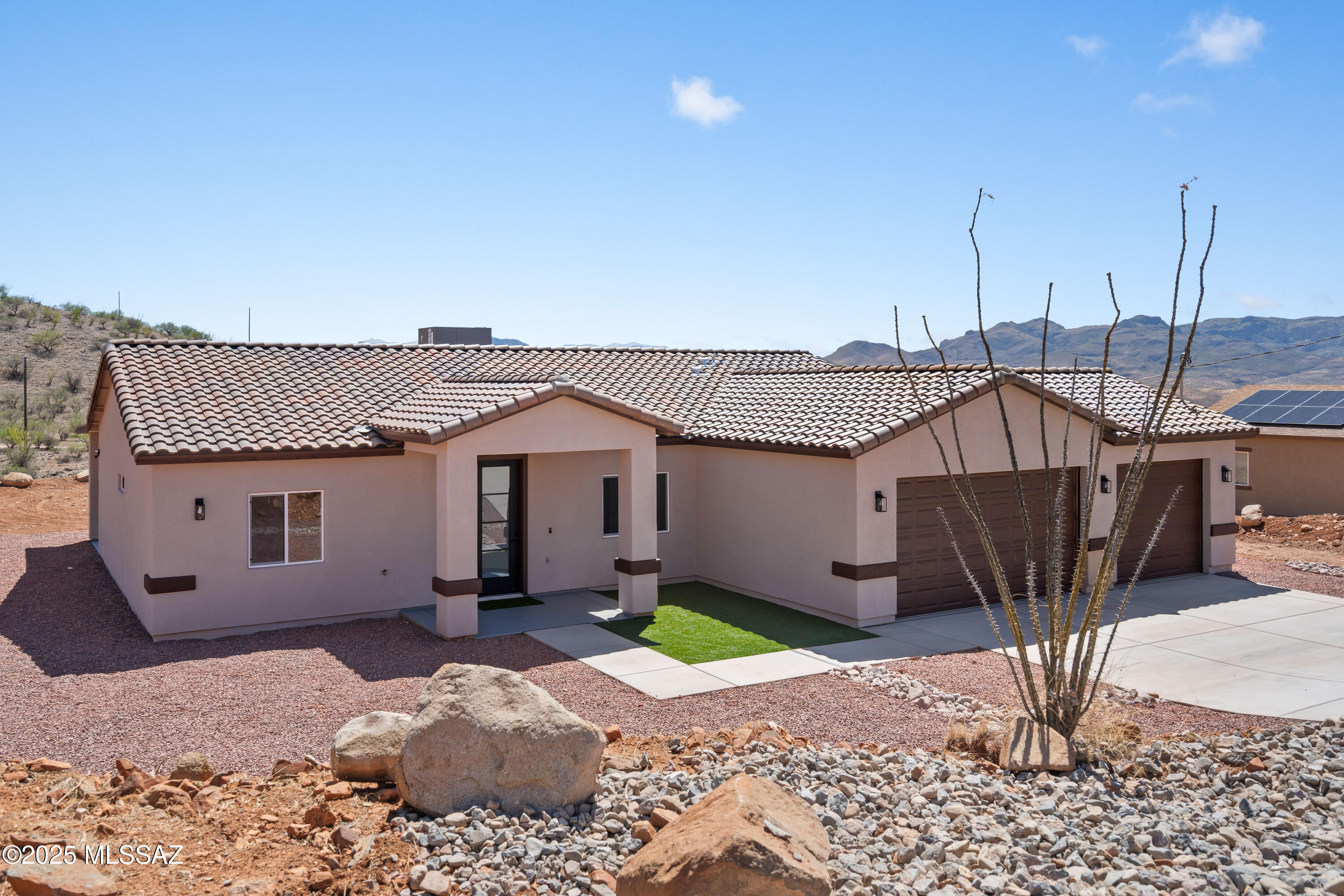 1667 Ave Calamar Rio Rico, AZ 85648 - Photo 3 of 33 a view of a house with a wooden fence