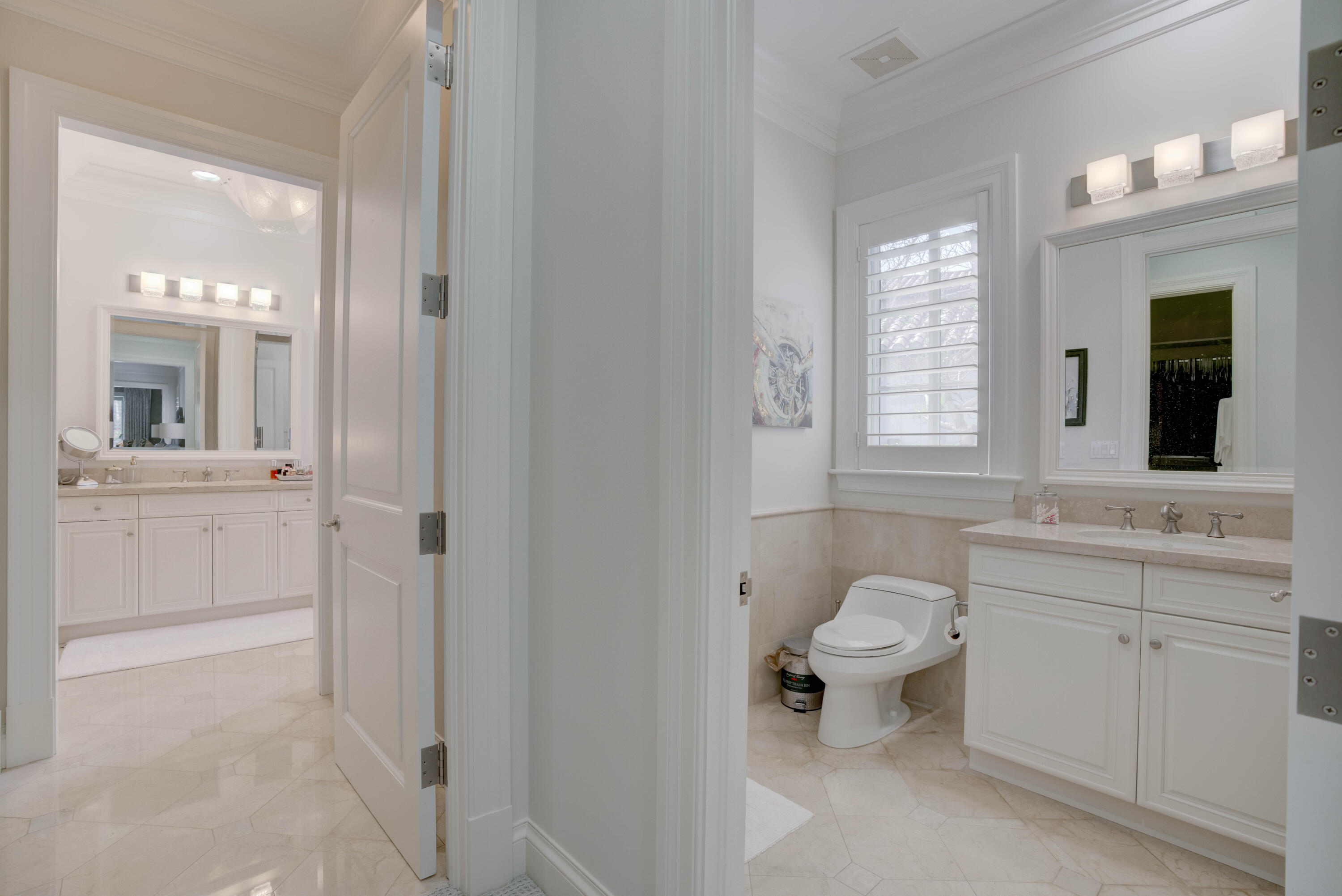 444 Red Hawk Drive Jupiter, FL 33477 - Photo 20 of 58 a bathroom with a toilet sink and mirror