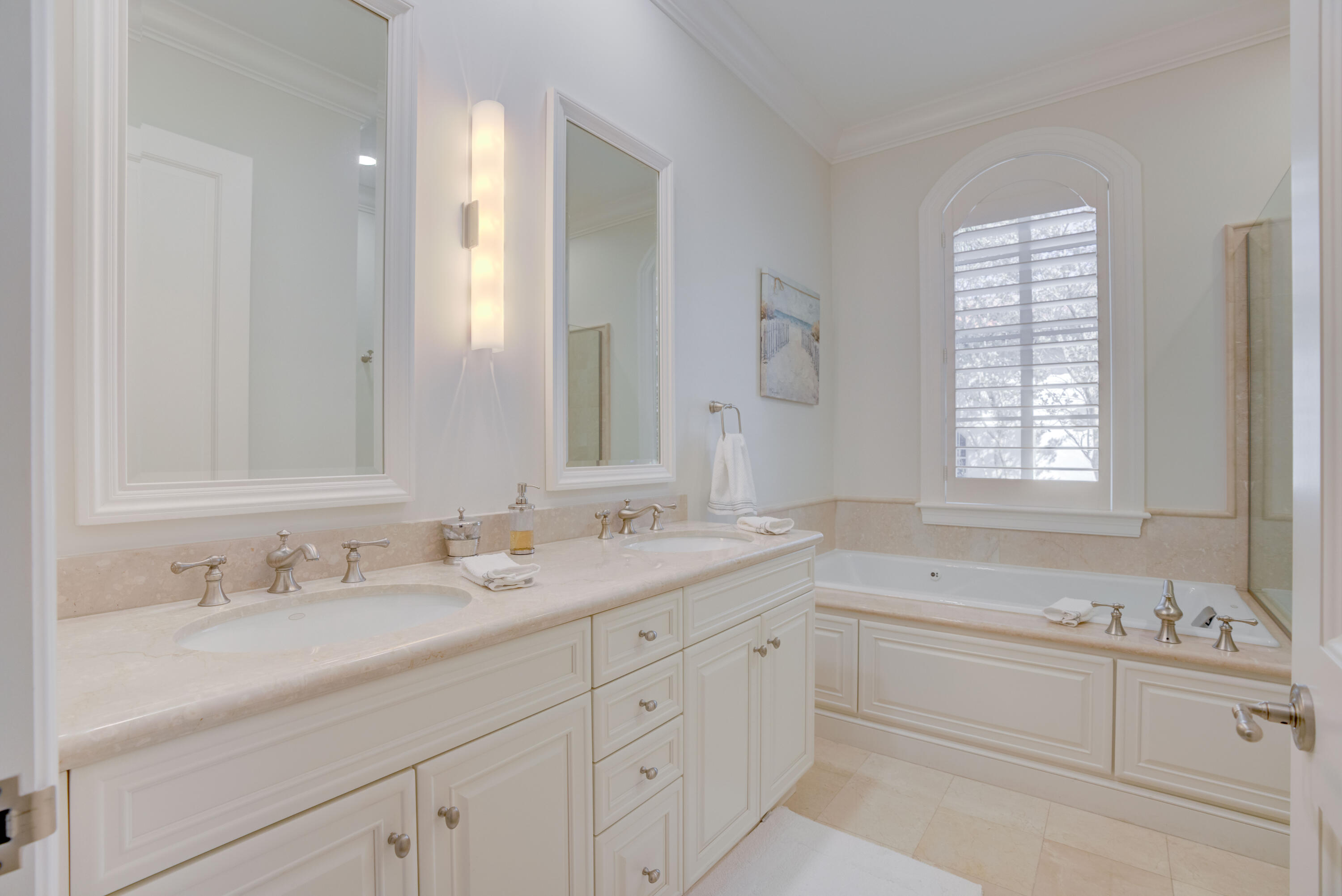 444 Red Hawk Drive Jupiter, FL 33477 - Photo 30 of 58 a bathroom with double sink and a window