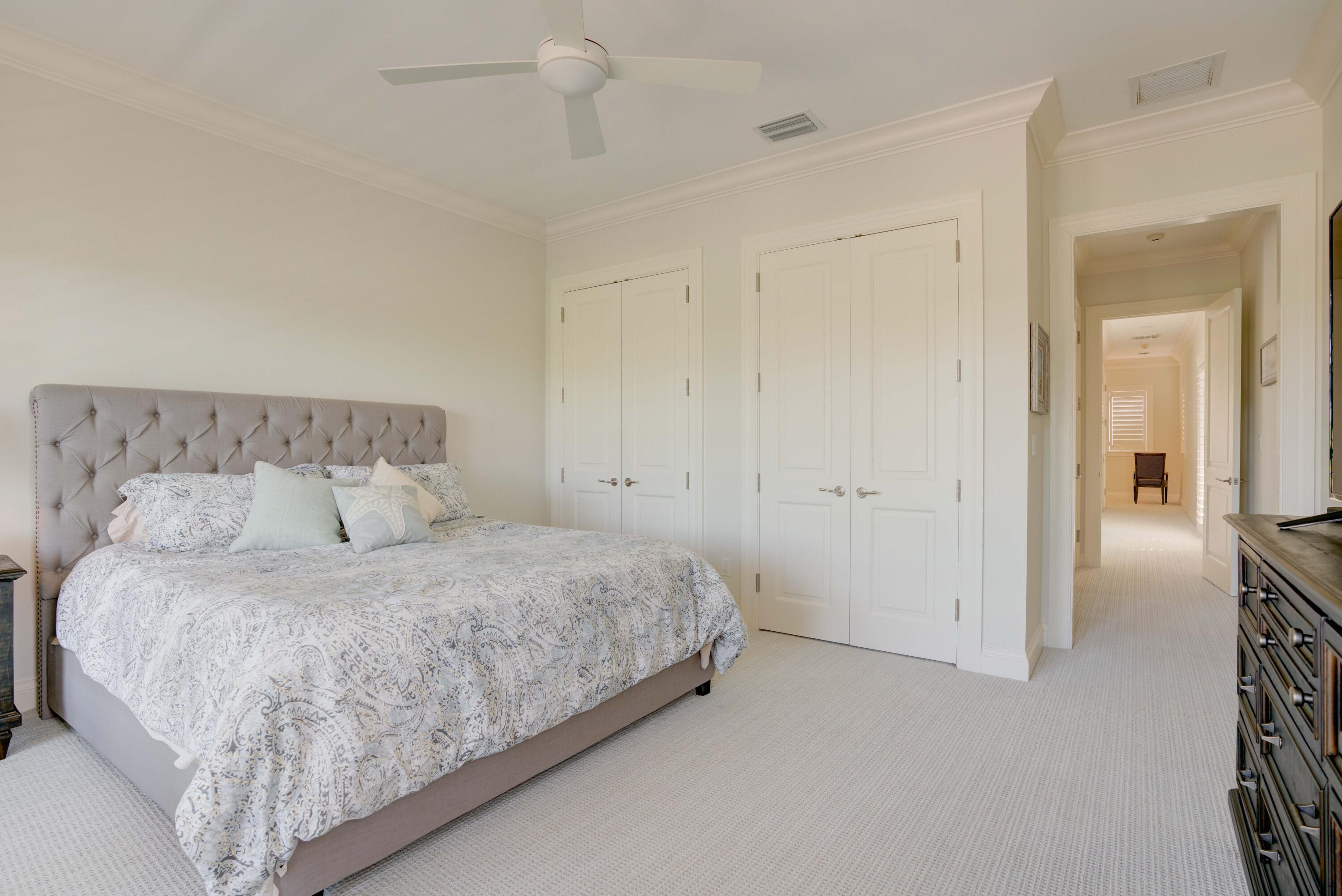 444 Red Hawk Drive Jupiter, FL 33477 - Photo 31 of 58 a bedroom with a bed and closet