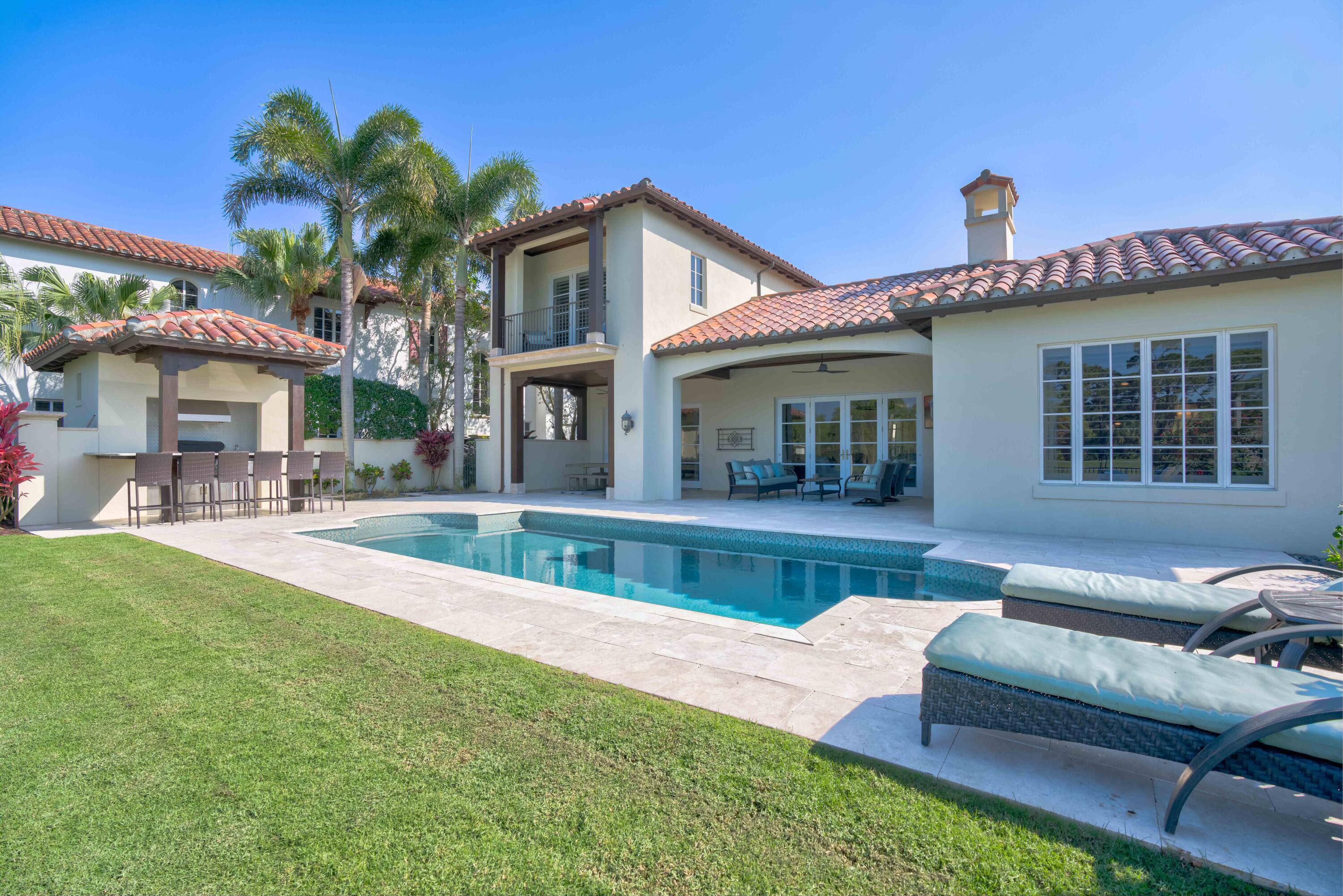 444 Red Hawk Drive Jupiter, FL 33477 - Photo 40 of 58 a view of a house with a swimming pool