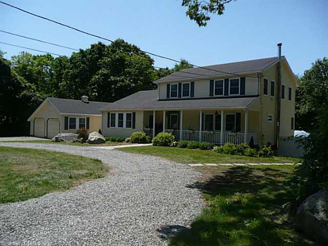 21 Happy Valley Road Westerly, RI 02891 - Photo 1 of 1 a front view of a house with a garden