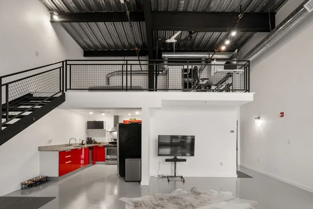 a balcony with table and chairs