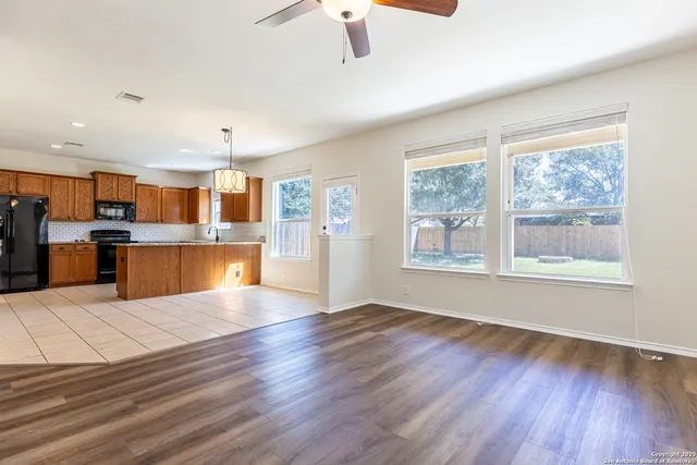 a view of kitchen with cabinets and wooden floor