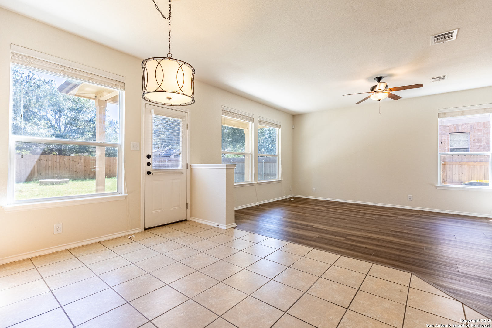 3013 Muntjac Schertz, TX 78154 - Photo 14 of 40 a view of an empty room with a window and wooden floor