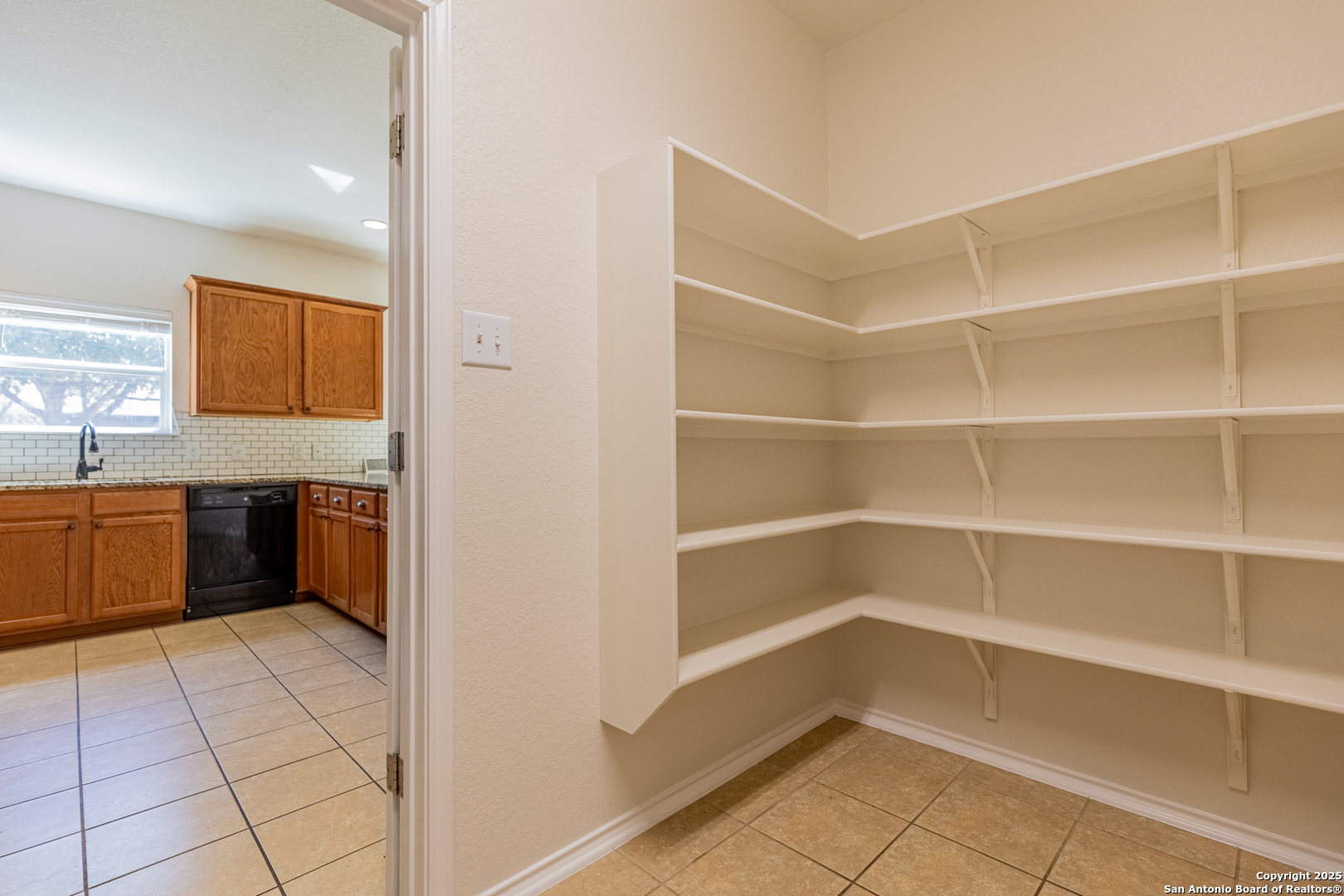 3013 Muntjac Schertz, TX 78154 - Photo 20 of 40 a view of a kitchen with a fridge and a sink