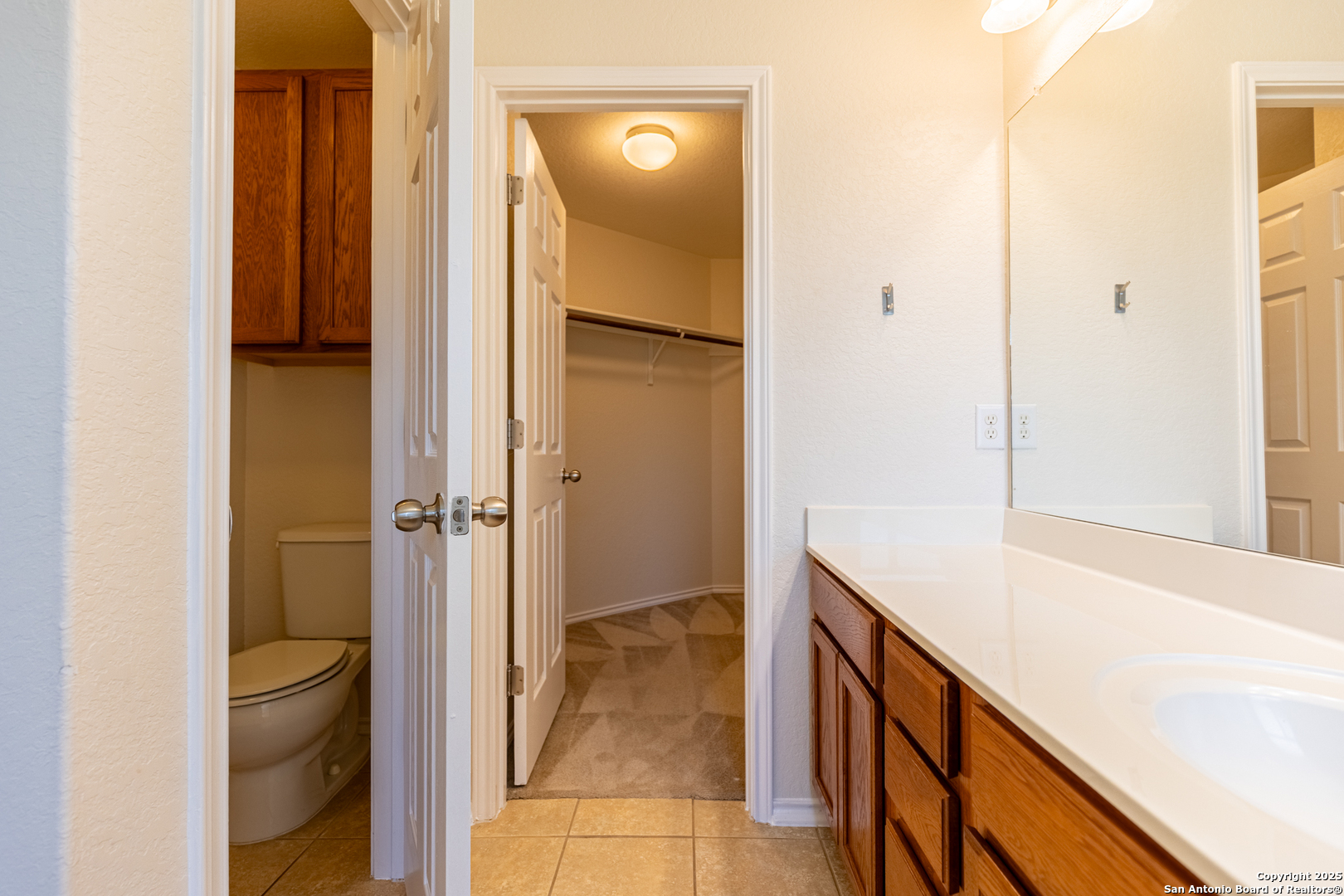 3013 Muntjac Schertz, TX 78154 - Photo 25 of 40 a bathroom with a sink and a mirror