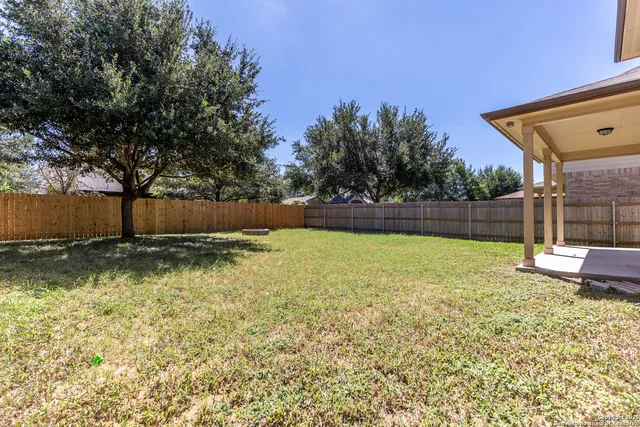 a view of backyard with green space
