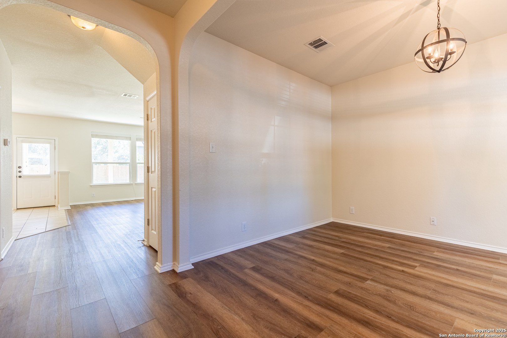 3013 Muntjac Schertz, TX 78154 - Photo 4 of 40 a view of a room with wooden floor and white walls