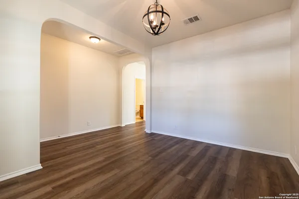a view of room with wooden floor