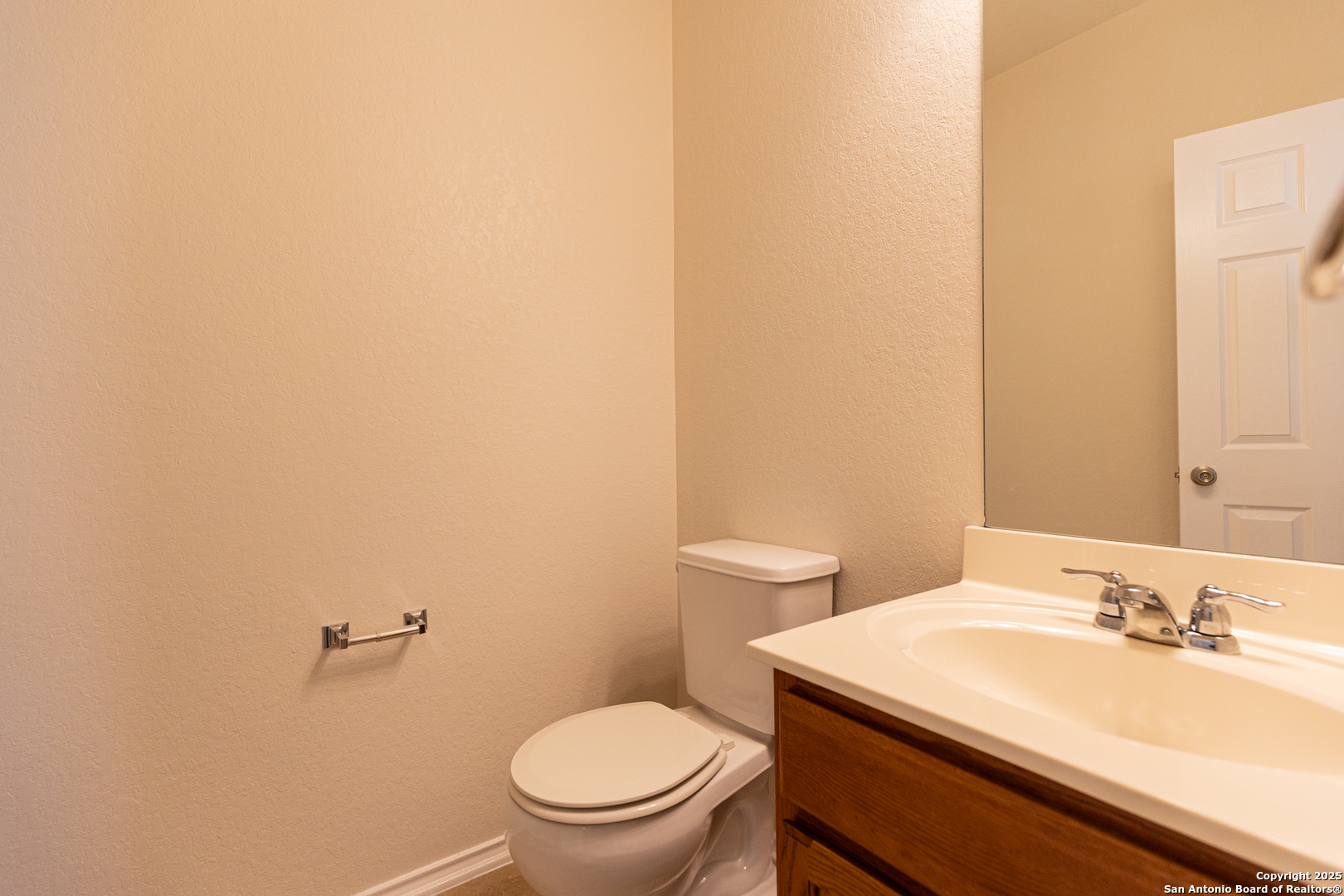 3013 Muntjac Schertz, TX 78154 - Photo 7 of 40 a bathroom with a sink a toilet and a mirror