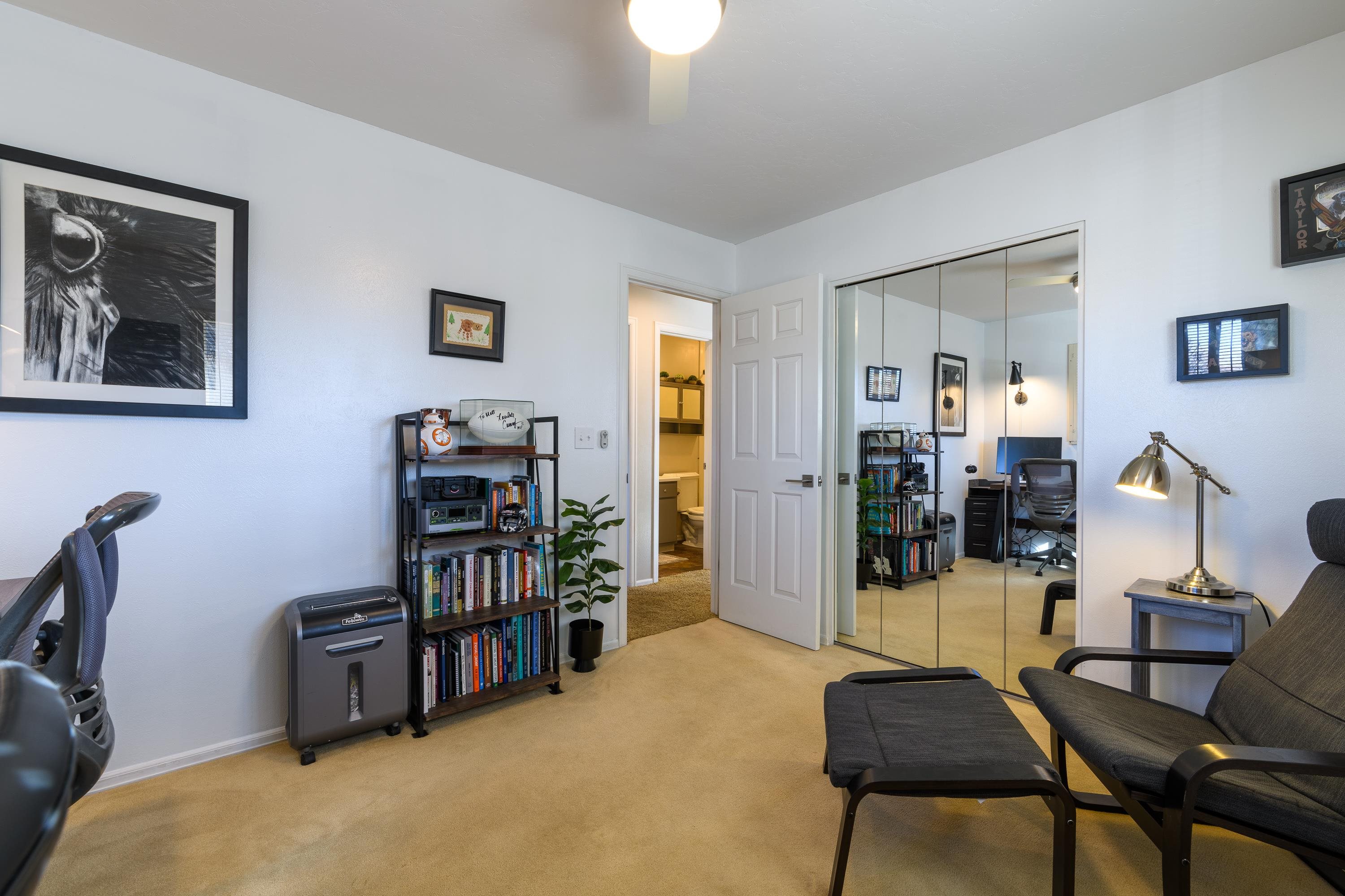 2700 G Road, Unit 5C Grand Junction, CO 81506 - Photo 20 of 25 a room with furniture and a book shelf