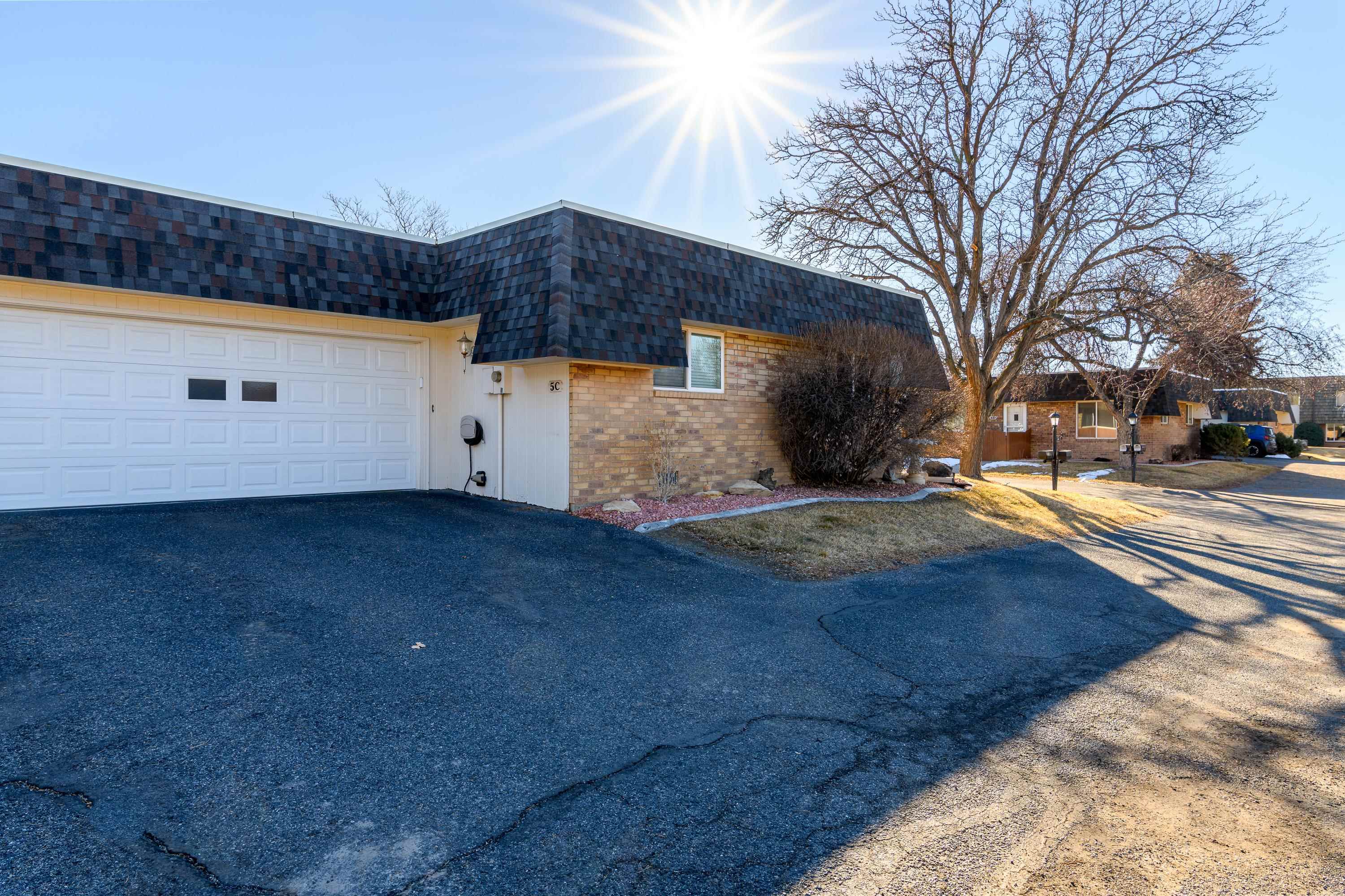 2700 G Road, Unit 5C Grand Junction, CO 81506 - Photo 22 of 25 a view of a yard with a large tree