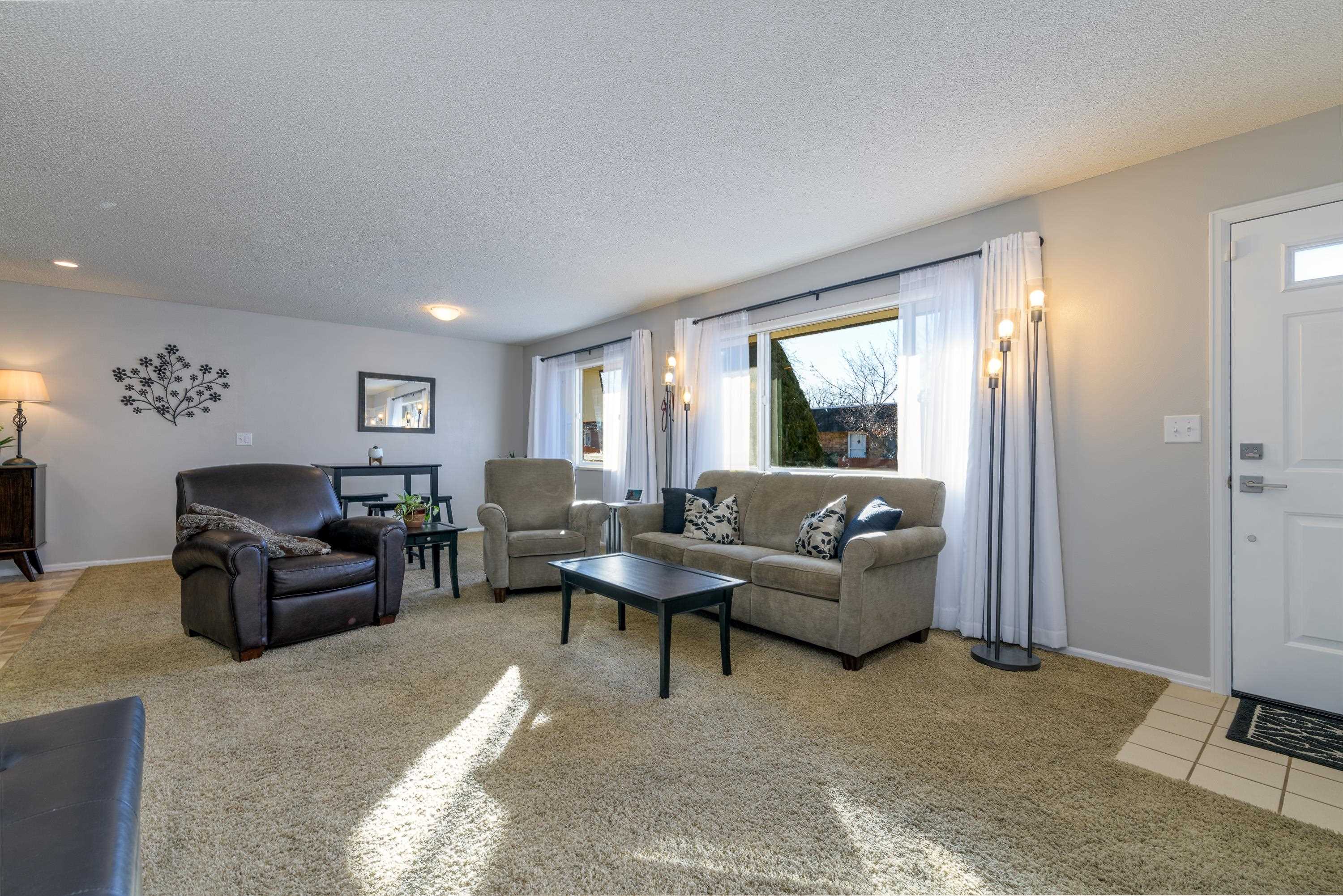 2700 G Road, Unit 5C Grand Junction, CO 81506 - Photo 5 of 25 a living room with furniture and a window