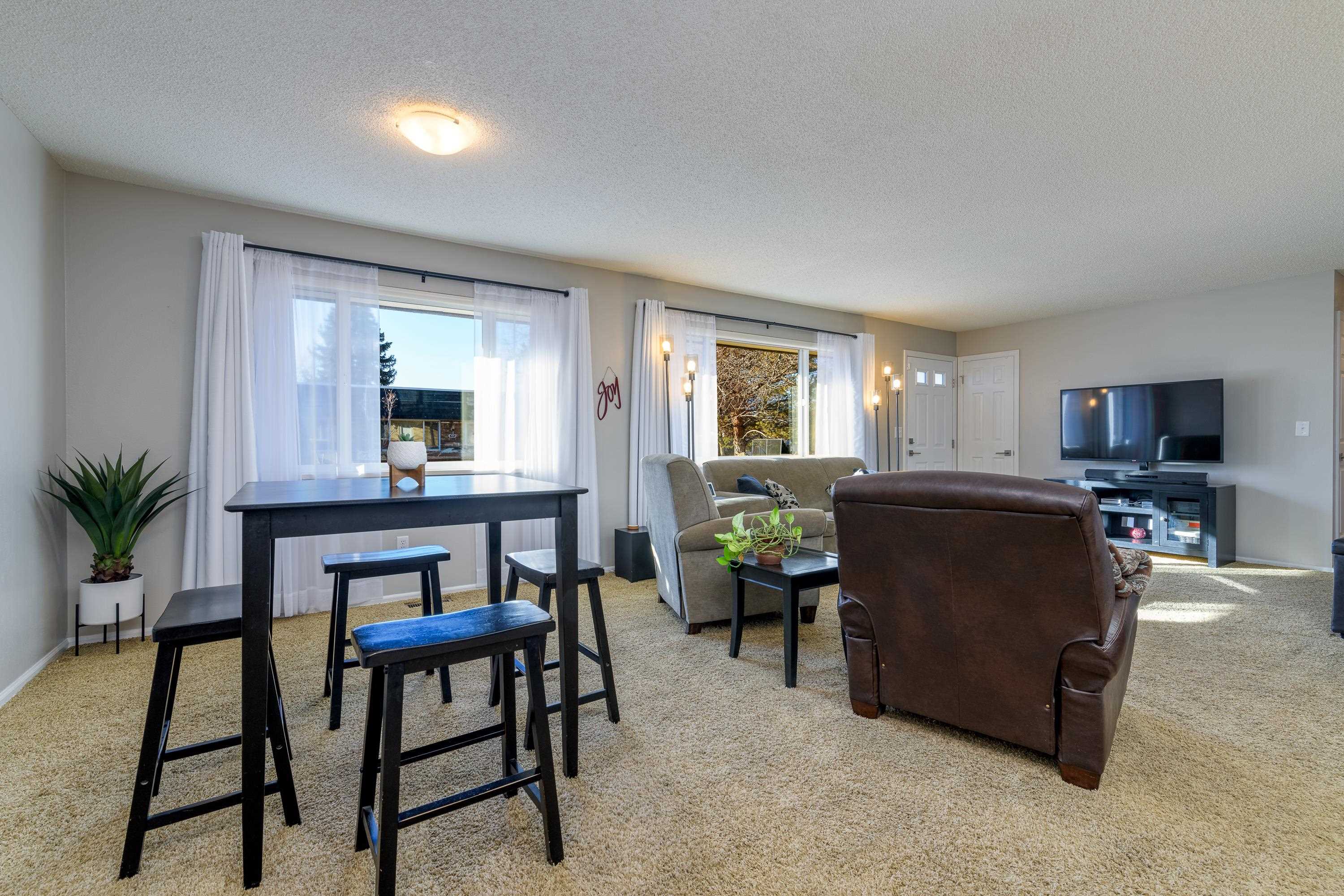 2700 G Road, Unit 5C Grand Junction, CO 81506 - Photo 6 of 25 a living room with furniture and a flat screen tv