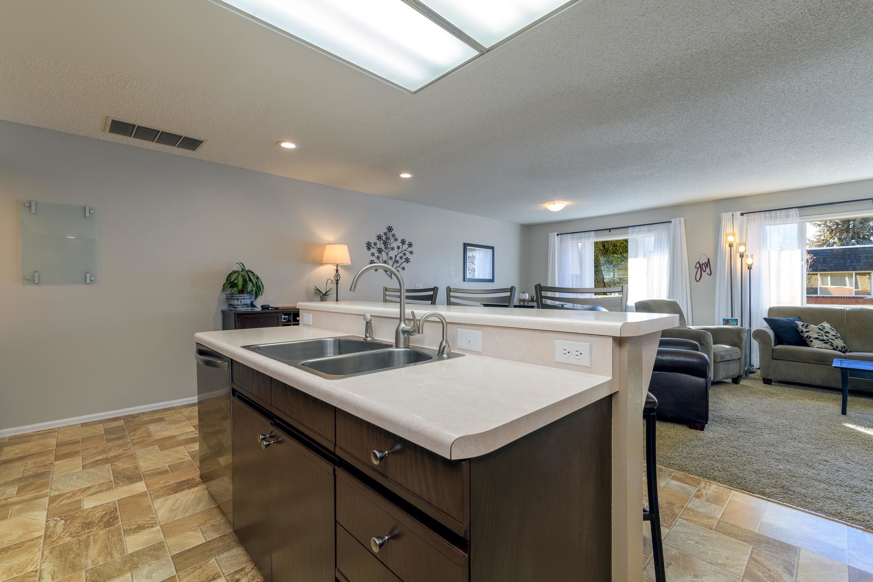 2700 G Road, Unit 5C Grand Junction, CO 81506 - Photo 10 of 25 a kitchen with a stove a sink and a refrigerator