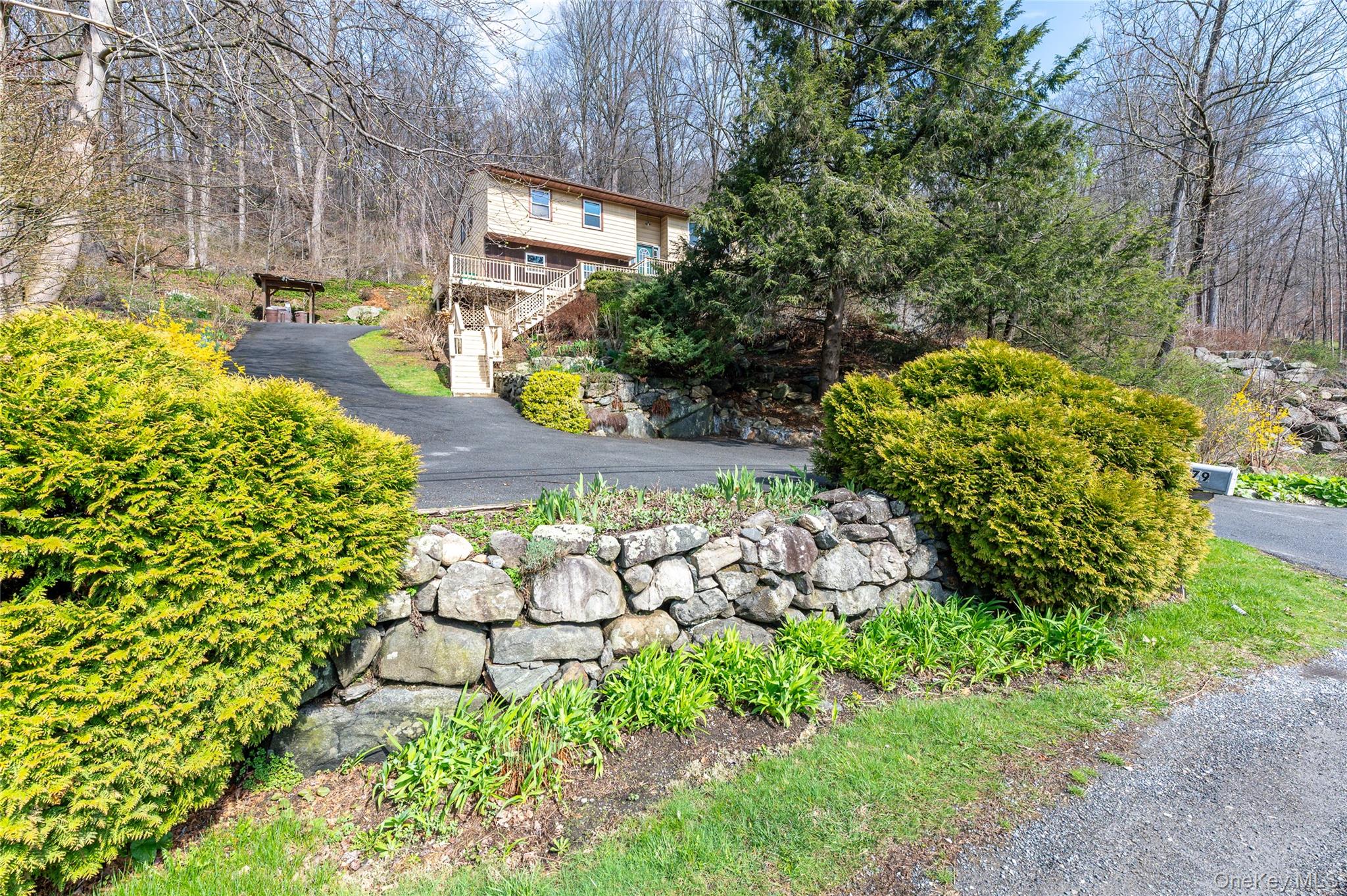 479 Sprout Brook Road Garrison, NY 10524 - Photo 1 of 1 a bunch of flowers in back yard