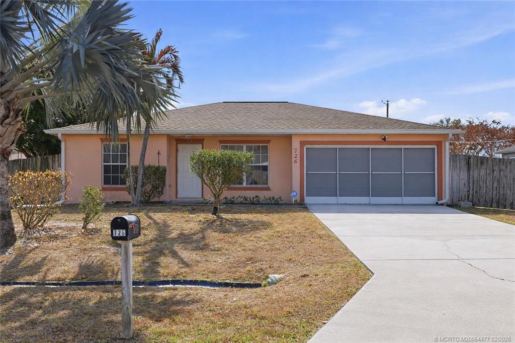 726 Southwest Bond Road Port St. Lucie, FL 34953 - Photo 1 of 31 a front view of a house with garden