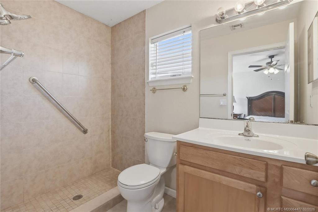 726 Southwest Bond Road Port St. Lucie, FL 34953 - Photo 21 of 31 a bathroom with a sink toilet and shower