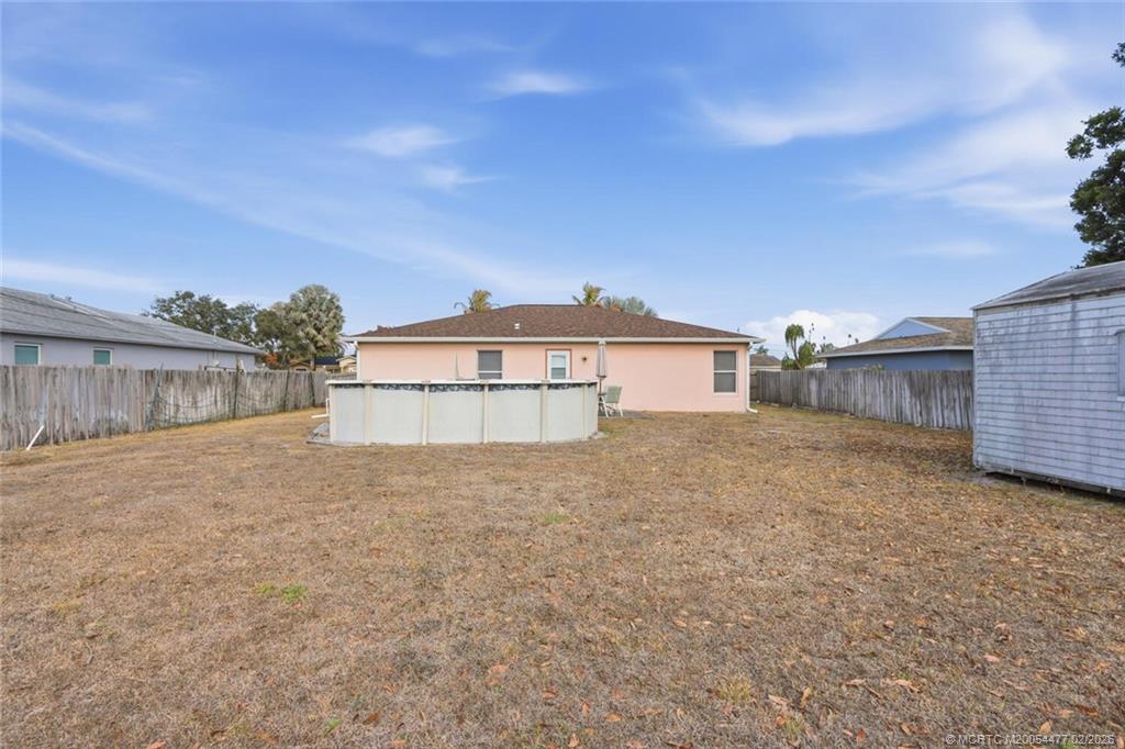 726 Southwest Bond Road Port St. Lucie, FL 34953 - Photo 27 of 31 a house view with a garden space
