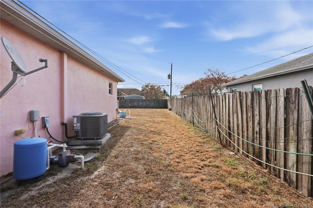 726 Southwest Bond Road Port St. Lucie, FL 34953 - Photo 29 of 31 a view of a backyard with sitting area