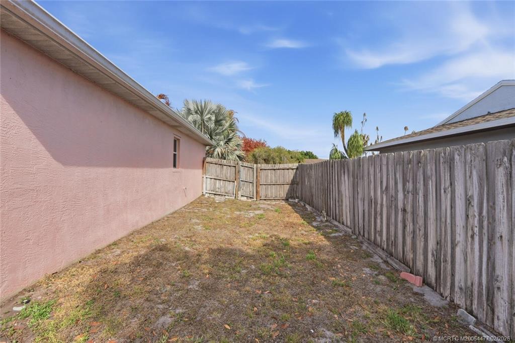 726 Southwest Bond Road Port St. Lucie, FL 34953 - Photo 30 of 31 a view of a backyard