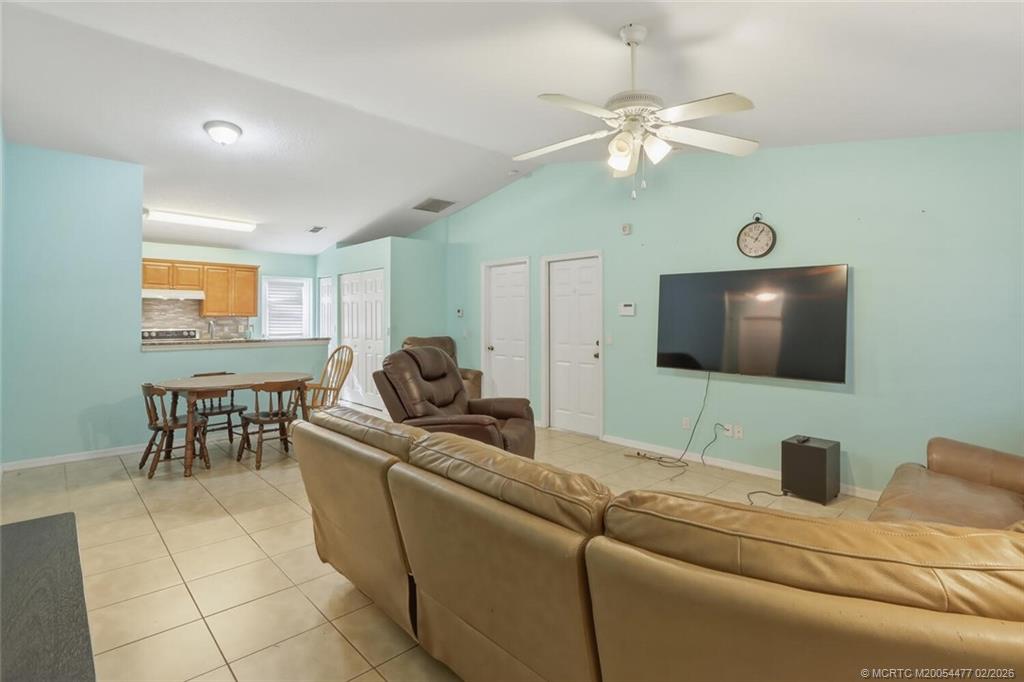 726 Southwest Bond Road Port St. Lucie, FL 34953 - Photo 6 of 31 a living room with furniture and a flat screen tv