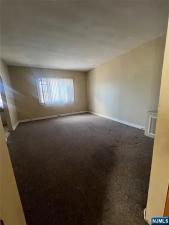 a view of empty room with stairs