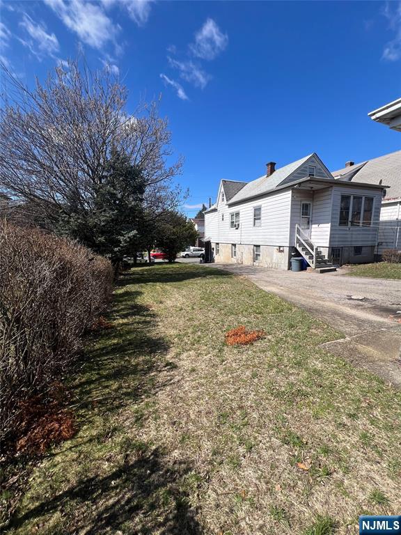 44 Scudder Street Garfield, NJ 07026 - Photo 18 of 21 a view of a house with a yard