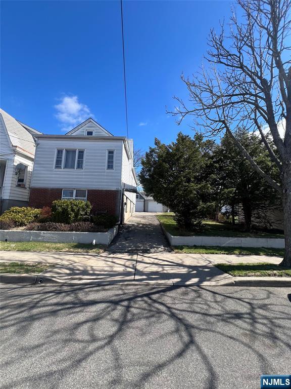 44 Scudder Street Garfield, NJ 07026 - Photo 2 of 21 a view of a house with a yard