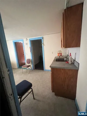 a room with furniture and mirror