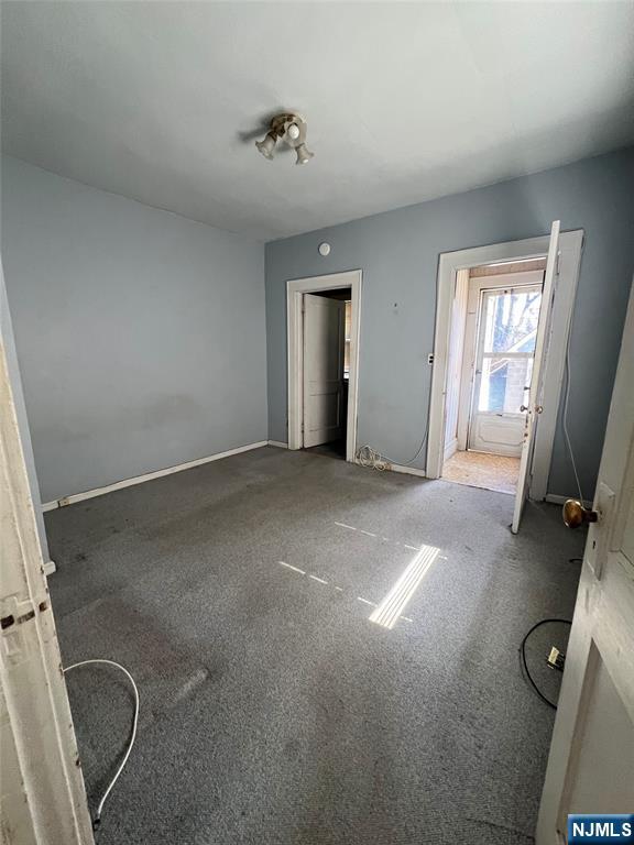 44 Scudder Street Garfield, NJ 07026 - Photo 5 of 21 an empty room with windows