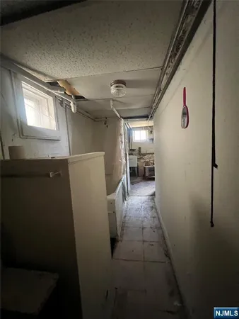 a view of storage and utility room with washer and dryer