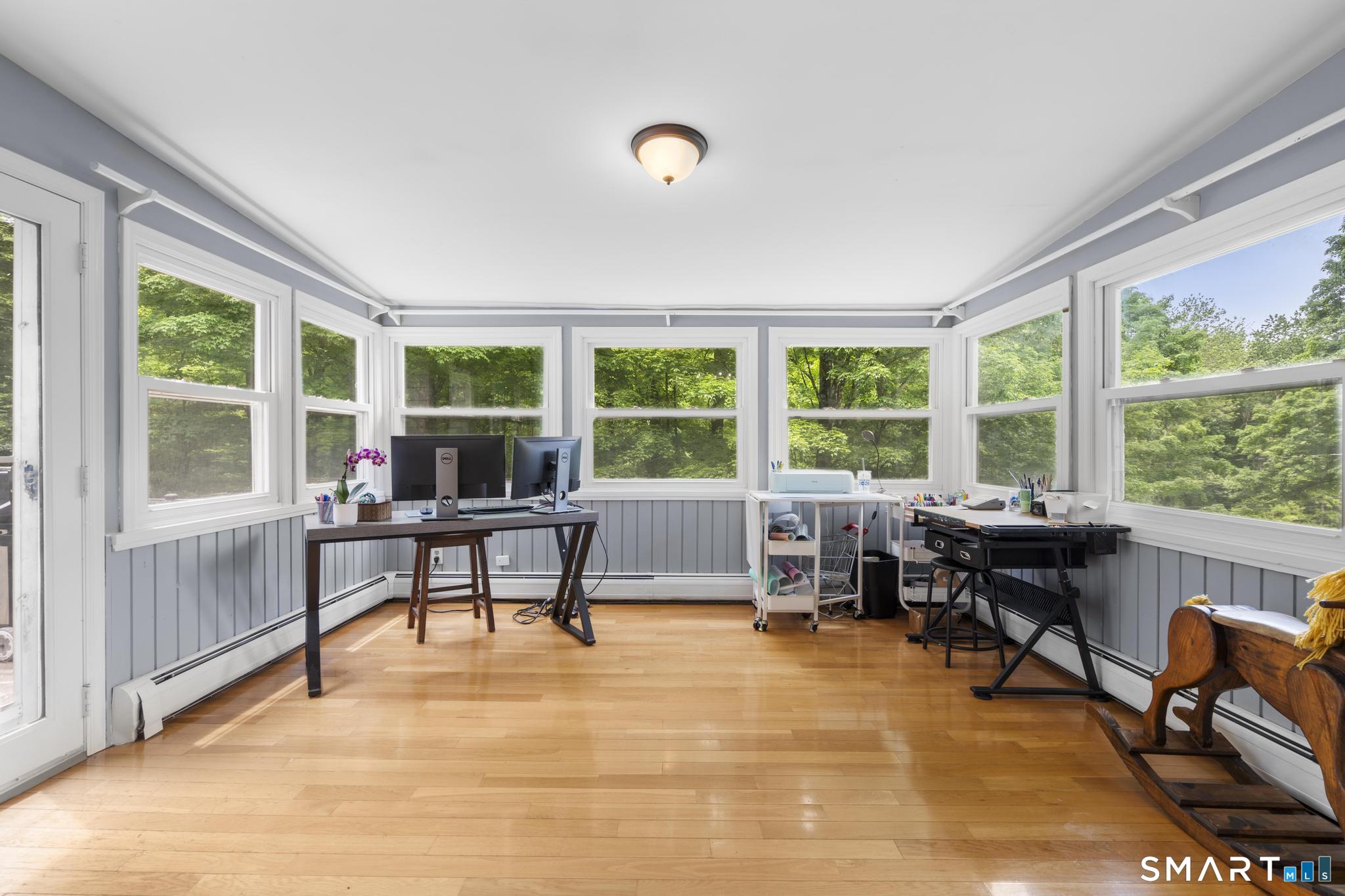 200 Old Huckleberry Road Wilton, CT 06897 - Photo 10 of 24 a work room with furniture and a window