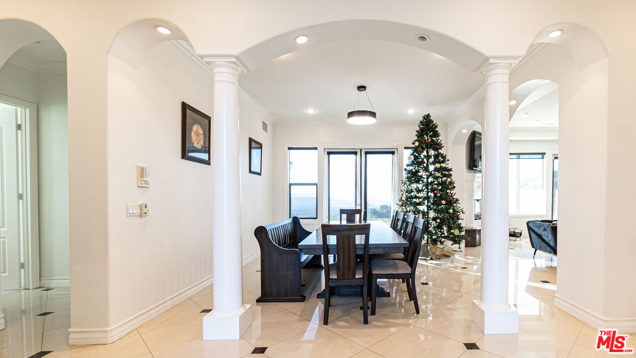 8321 Overview Court Yucaipa, CA 92399 - Photo 11 of 75 a view of a dining room with furniture and chandelier