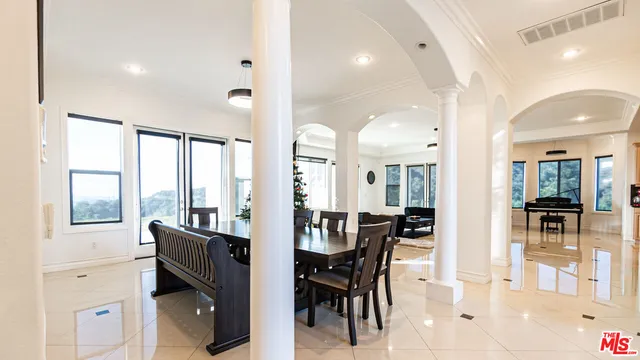 a living room with furniture fireplace and flat screen tv