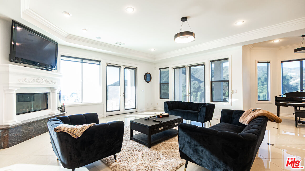 8321 Overview Court Yucaipa, CA 92399 - Photo 14 of 75 a living room with furniture fireplace and flat screen tv
